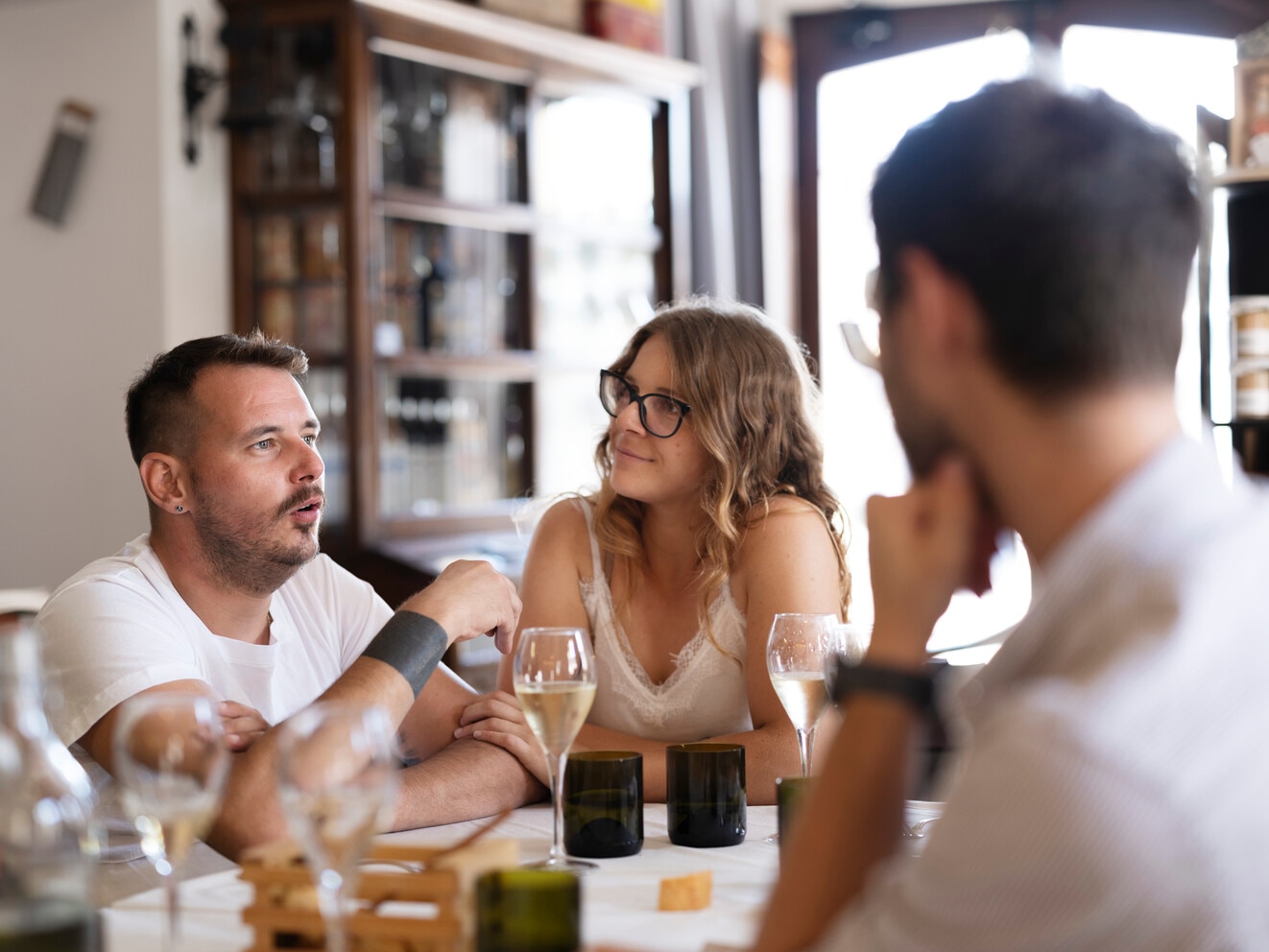 Photo of Mattia, sitting with his friends. Sometimes, it may be possible for a person to use both high- and low-volume TAI.